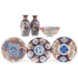Japanese Imari porcelain including a pair of vases hand painted with flowers, the largest 19cm high
