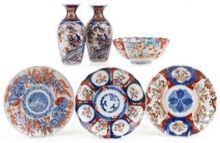 Japanese Imari porcelain including a pair of vases hand painted with flowers, the largest 19cm high