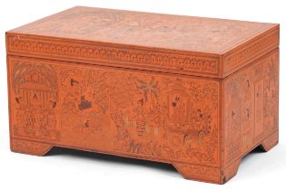Burmese red lacquered trunk with hinged lid profusely hand painted with panels of deities in
