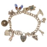 Silver charm bracelet with love heart padlock and a collection of mostly silver charms including a