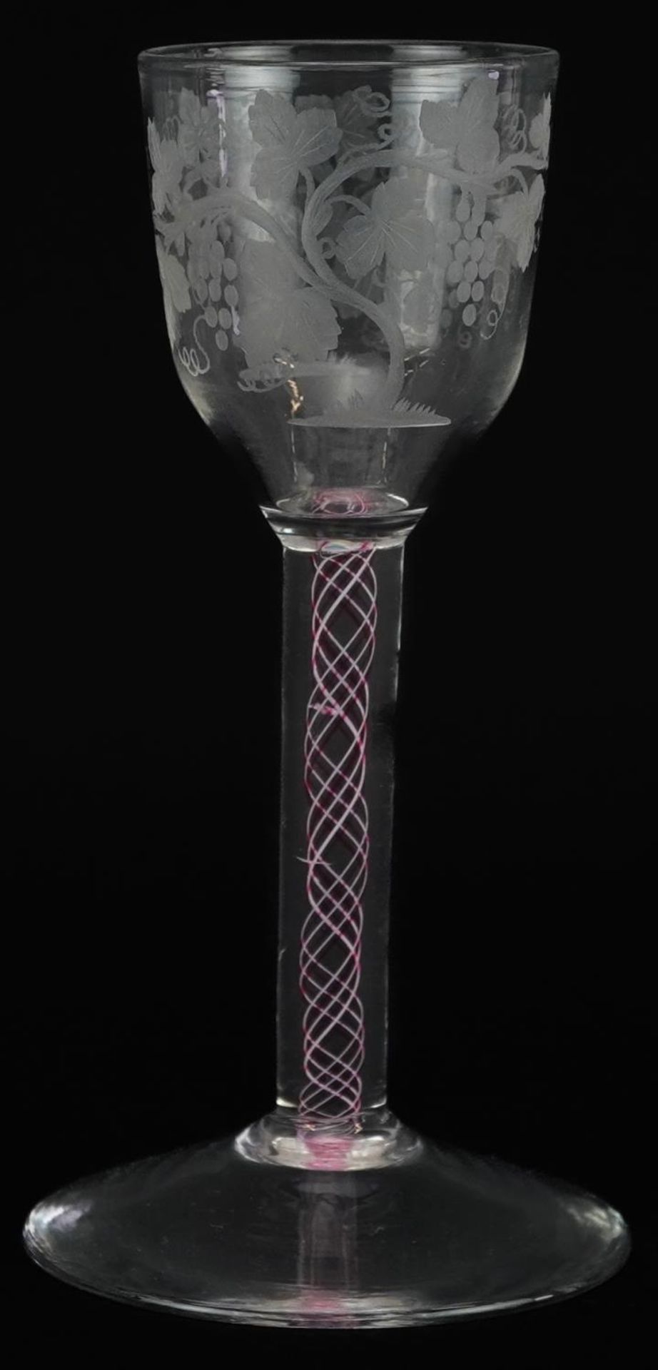 18th century wine glass with multi coloured opaque twist stem and bowl engraved with leaves and