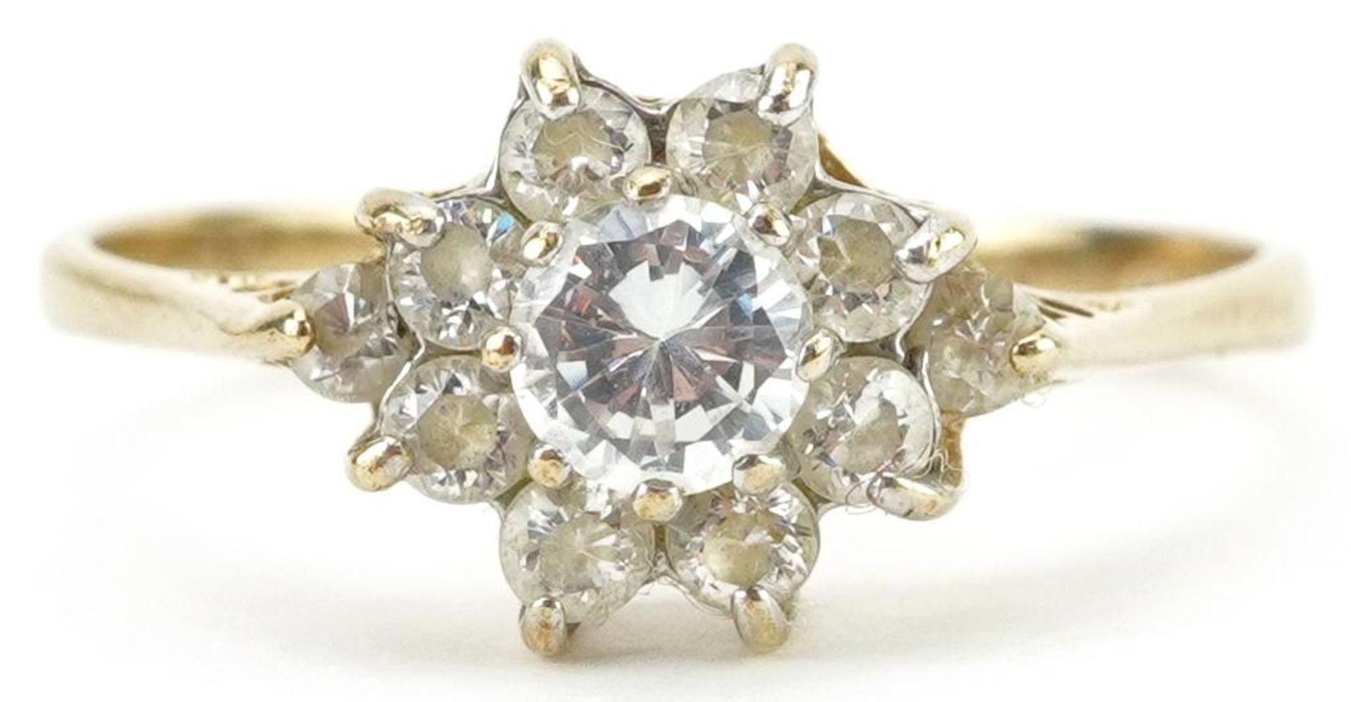 9ct gold cubic zirconia flower head ring with pierced setting, size L, 1.6g
