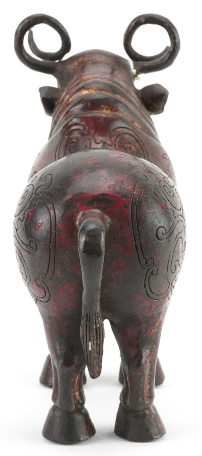 Chinese partially gilt and red lacquered bronze mythical animal, 22.5cm in length - Image 3 of 7