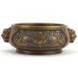 Chinese patinated bronze censer with animalia handles cast in relief with panels of flowers, four