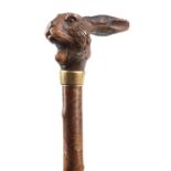 Late 19th century gnarled wood parasol with carved Black Forest hare design mechanical open and