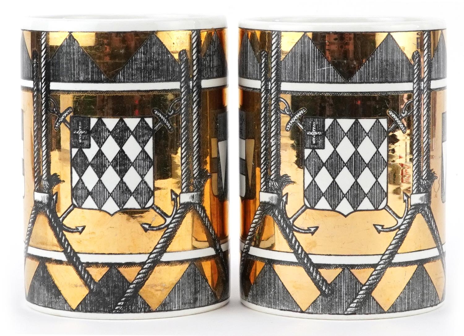 Piero Fornasetti, pair of vintage Italian gold lustre mugs decorated with shields, each 12.5cm high - Image 2 of 5