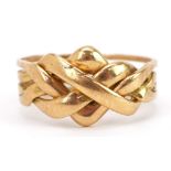 18ct gold four section puzzle ring, size J, 6.0g