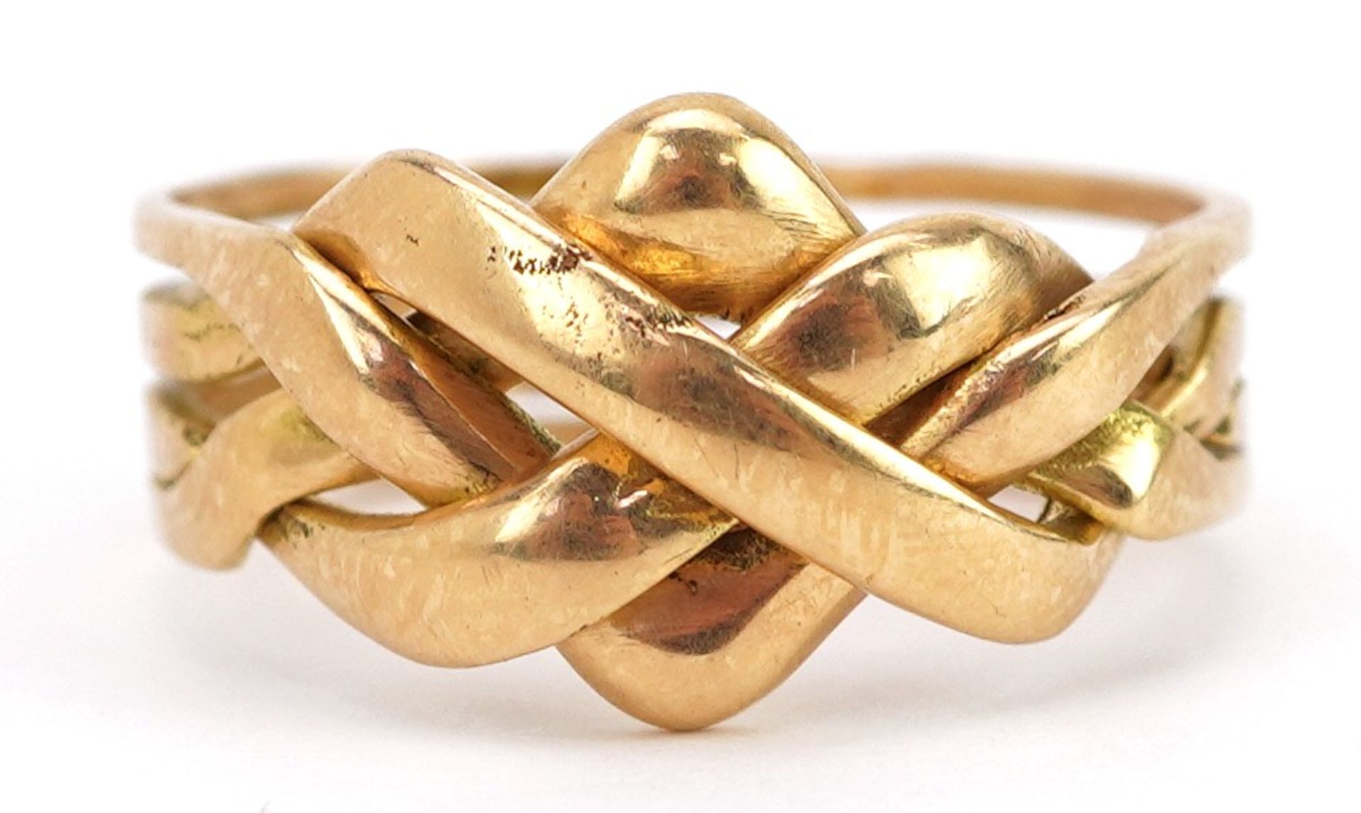 18ct gold four section puzzle ring, size J, 6.0g