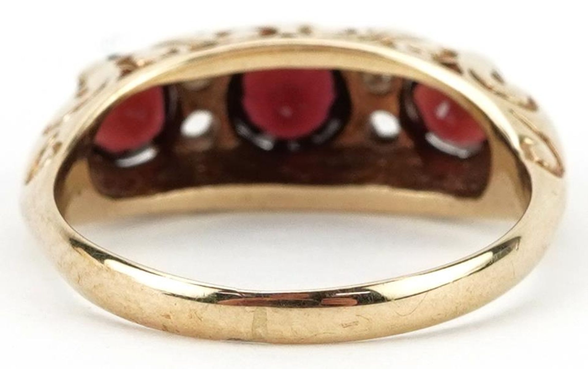 9ct gold garnet and white spinel seven stone ring with ornate pierced setting, size J, 2.5g - Bild 2 aus 4