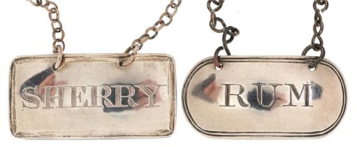 Two George III silver decanter labels comprising sherry and rum, 1800 and 1814, each 4.4cm wide,