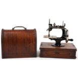 Early 20th century continental cast iron child's sewing machine with dome top case