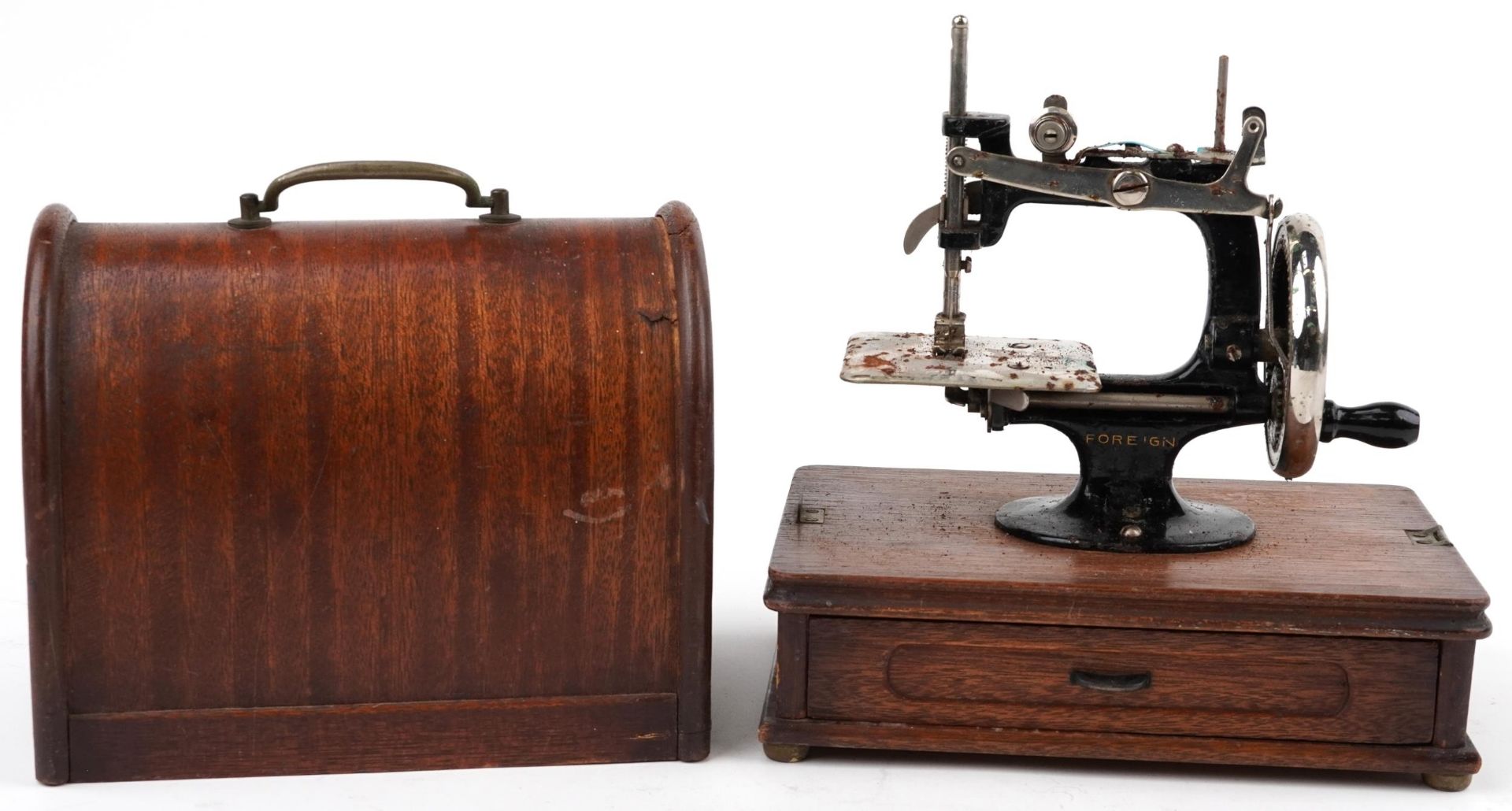 Early 20th century continental cast iron child's sewing machine with dome top case