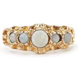 Victorian style cabochon opal five stone ring with ornate setting, the largest opal approximately