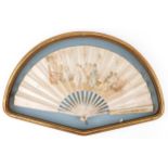 19th century European silk and cream painted brisee fan housed in a gilt frame, overall 61cm wide