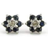 Pair of 9ct diamond and blue spinel flower head stud earrings, 8mm in diameter