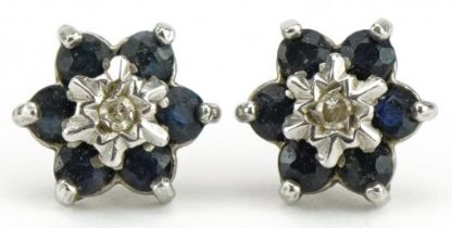 Pair of 9ct diamond and blue spinel flower head stud earrings, 8mm in diameter