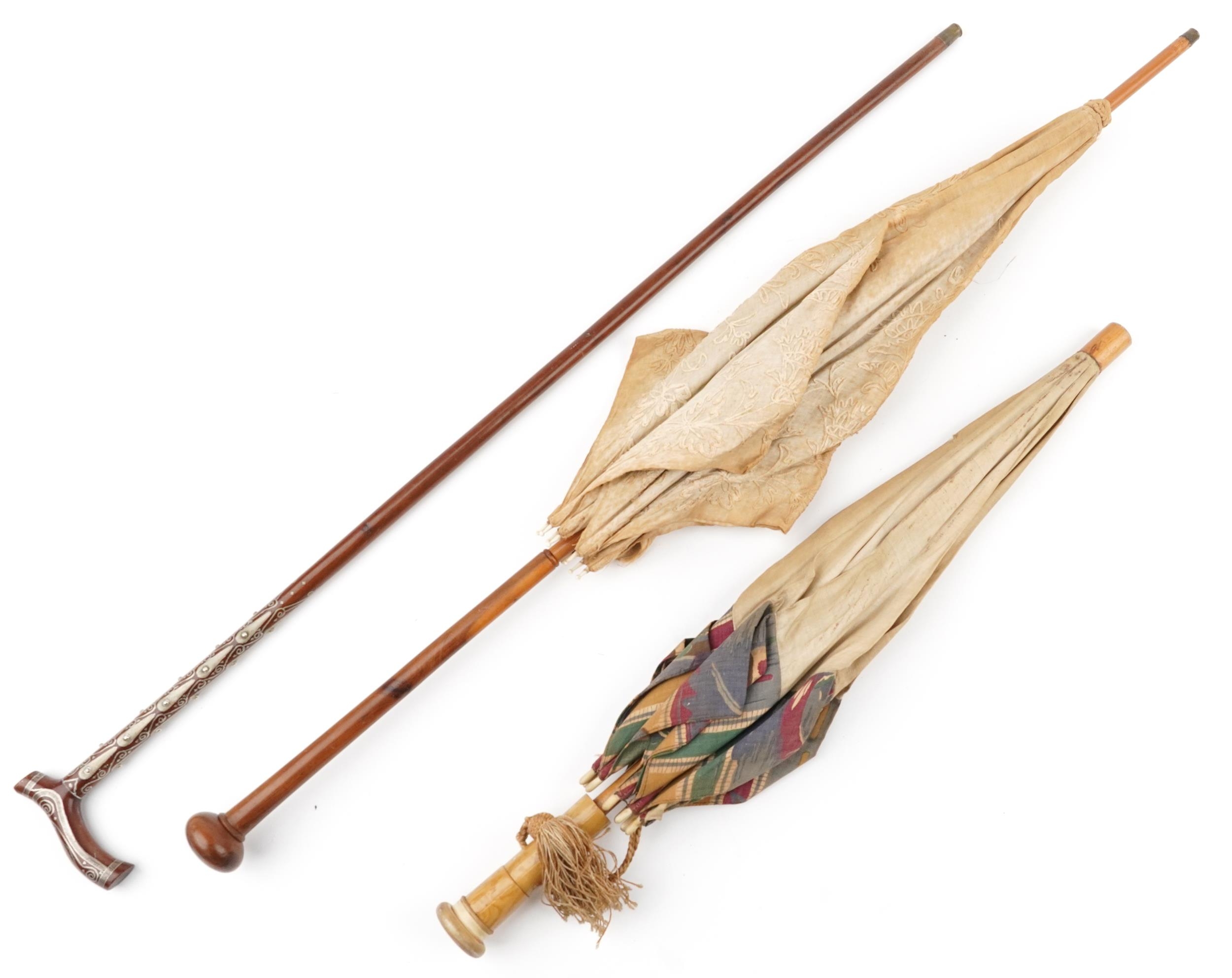 Two early 20th century parasols and a Middle Eastern hardwood walking stick with foliate metal - Image 3 of 7