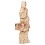 Chinese russet and white jade carving of a young female, 10.5cm high
