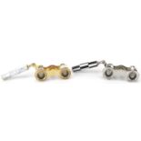 Two pairs of opera glasses including brass pair with mother of pearl, each 10cm wide