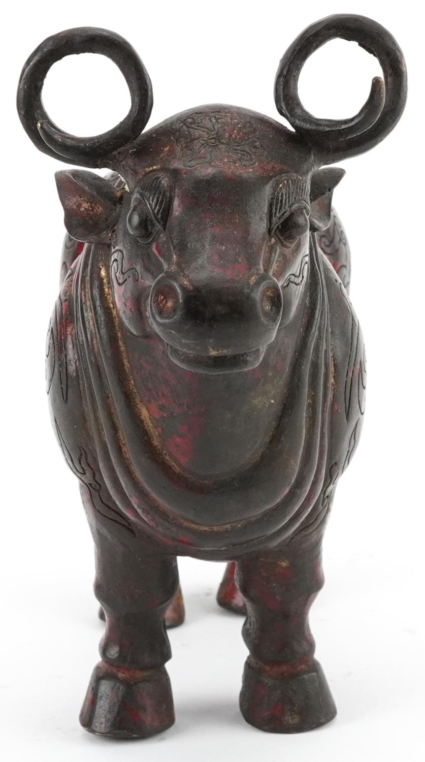 Chinese partially gilt and red lacquered bronze mythical animal, 22.5cm in length - Image 5 of 7