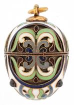 Silver gilt and enamel egg pendant set with garnet cabochons, impressed Russian marks to the