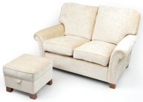 Contemporary beige upholstered two seater settee with matching footstool, 100cm H x 145cm W x