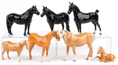 Seven Beswick horses and foals including four tan examples, the largest 22cm in length