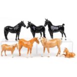 Seven Beswick horses and foals including four tan examples, the largest 22cm in length