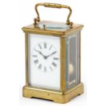Large French brass cased repeating carriage clock striking on a gong with enamelled dial having