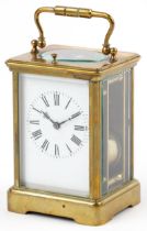 Large French brass cased repeating carriage clock striking on a gong with enamelled dial having