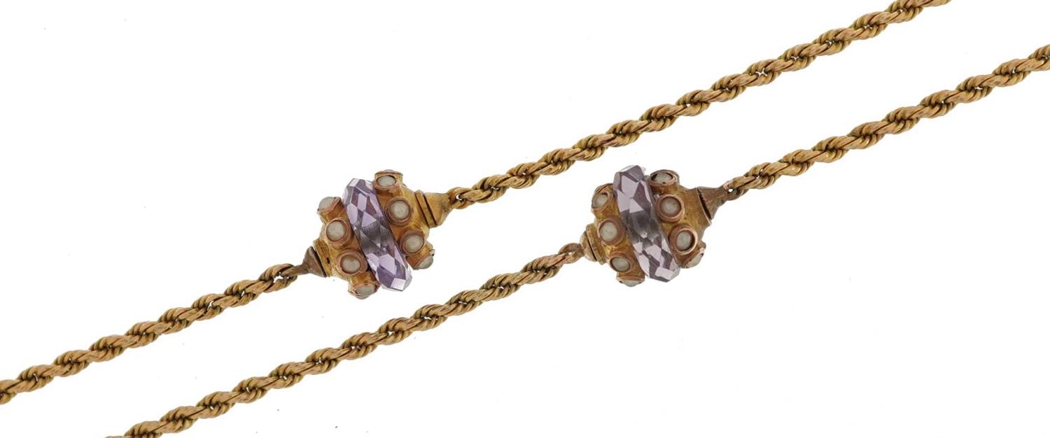 Unmarked gold amethyst and seed pearl rope twist necklace, tests as 9ct gold, 60cm in length, 7.7g