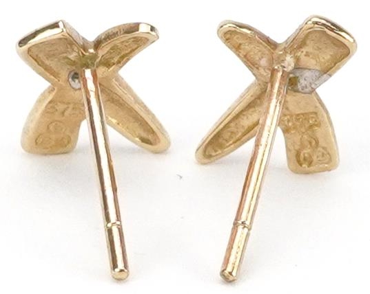 Pair of 9ct gold diamond cross stud earrings, each 1cm wide, total 0.6g - Image 2 of 2