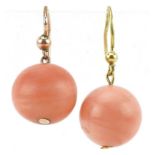 Pair of Victorian unmarked gold pink coral drop earrings, the coral approximately 12mm x 11mm, total