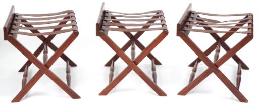 Three mahogany and leather butler's luggage stands, each 54cm H x 68cm W x 51cm D PROVENANCE: