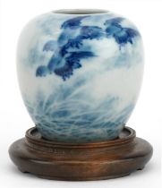 Chinese blue and white porcelain vase with hardwood stand hand painted with birds above waves,