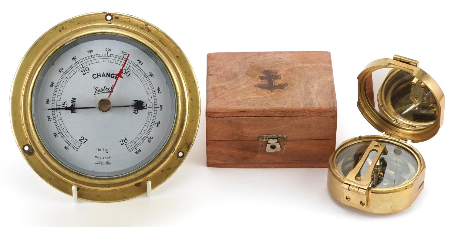 Shipping interest bulk head Sestrel wall barometer and a naval interest compass with hardwood