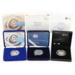 Three commemorative silver proof coins with fitted cases and certificates by The Royal Mint, two