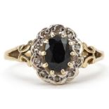 9ct gold sapphire and diamond cluster ring with pierced shoulders, the sapphire approximately 7.