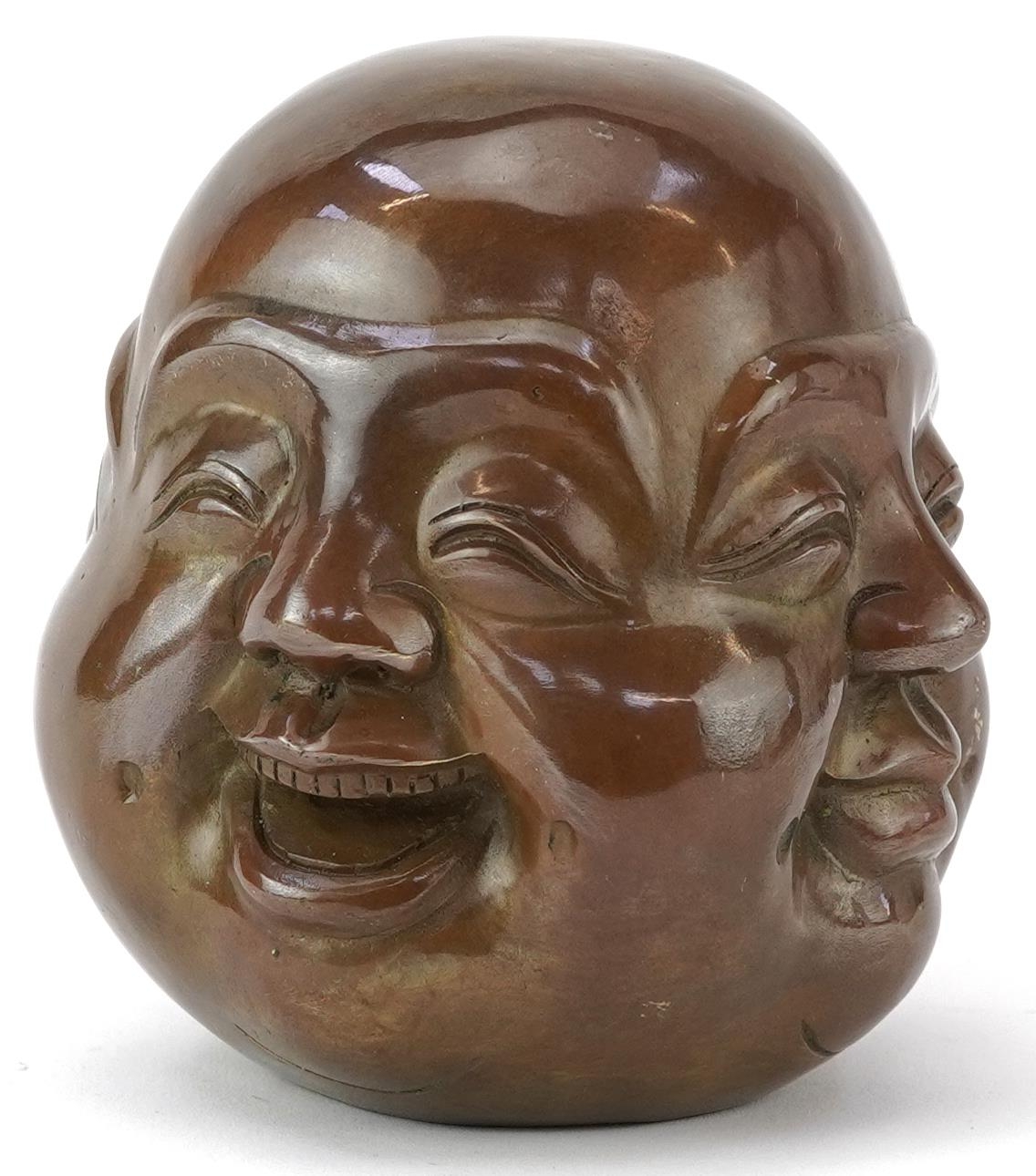 Chinese patinated bronze four face Buddha paperweight, character marks to the base, 12cm high