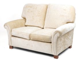 Contemporary beige upholstered two seater settee, 100cm H x 145cm W x 100cm D