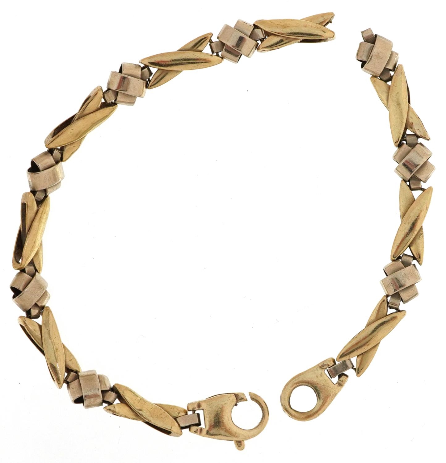 Modernist broken two tone 9ct gold crossover bracelet, 19cm in length, 9.9g - Image 2 of 3