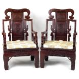 Pair of Chinese carved hardwood throne seats with lift of cushioned seats, possibly Hongmu, each