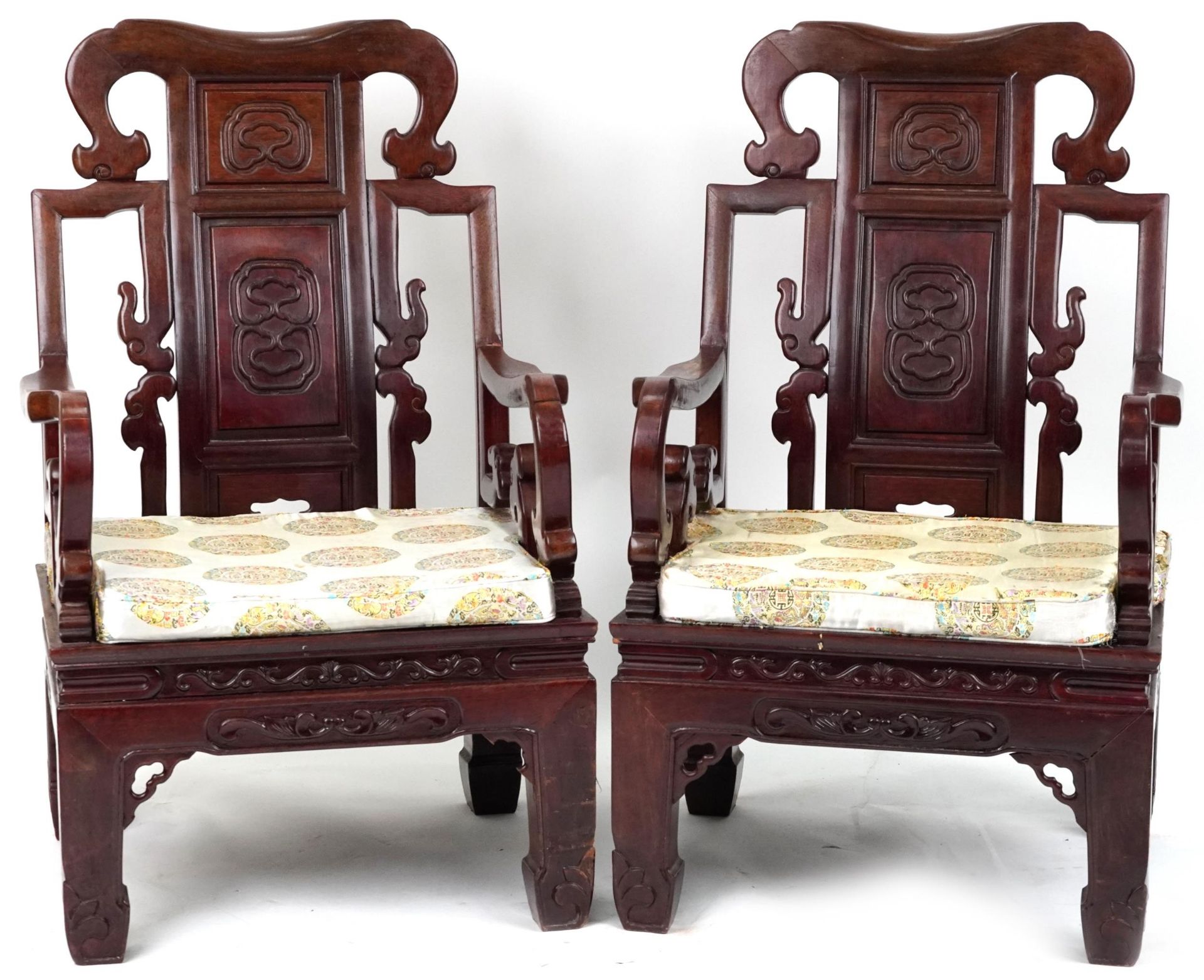 Pair of Chinese carved hardwood throne seats with lift of cushioned seats, possibly Hongmu, each