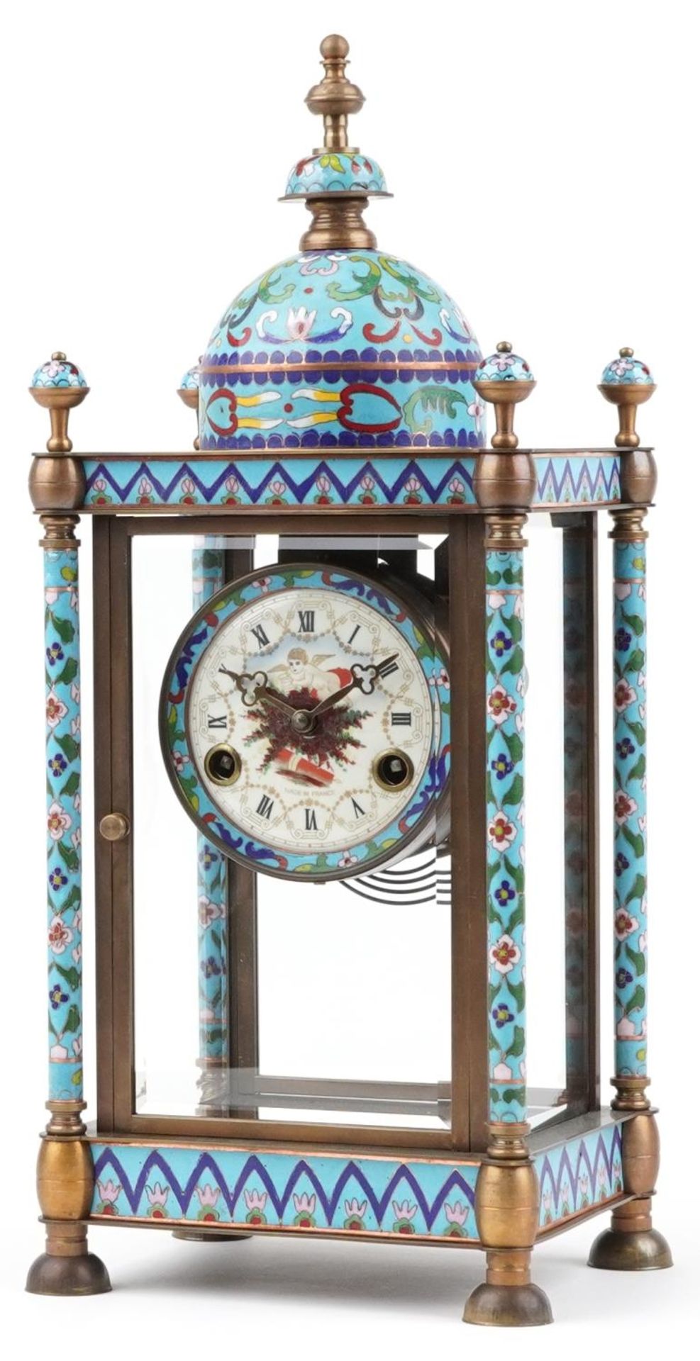 French champleve enamel and brass four glass mantle clock striking on a gong, the enamelled dial