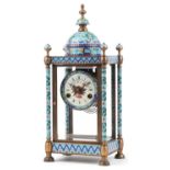 French champleve enamel and brass four glass mantle clock striking on a gong, the enamelled dial