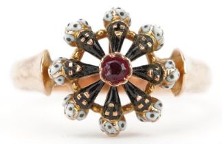 Victorian unmarked gold and enamel Blackamoor head ring set with a central garnet and rotating head,