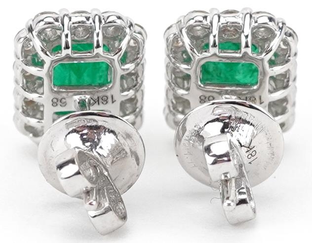 Pair of 18ct white gold emerald and diamond cluster stud earrings, total emerald weight - Image 2 of 3