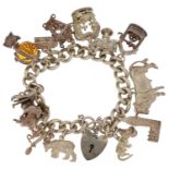 Silver charm bracelet with love heart padlock and a collection of mostly silver charms, including