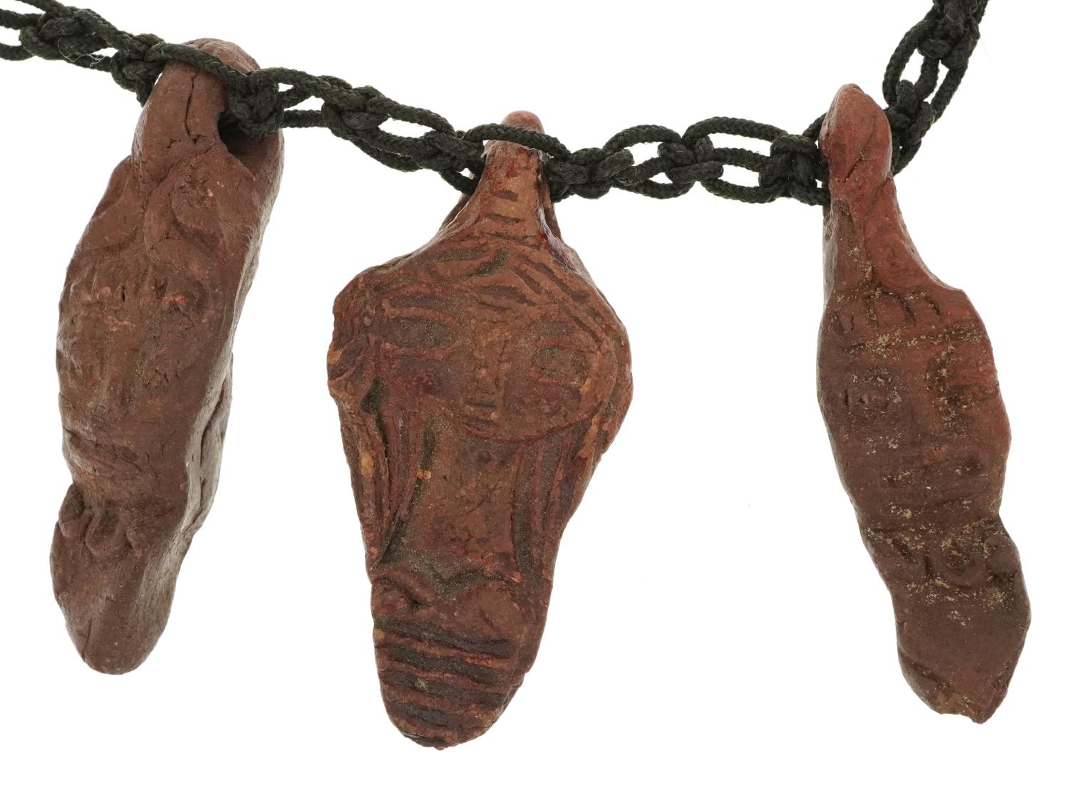 Tribal interest pottery figural necklace, 50cm in length