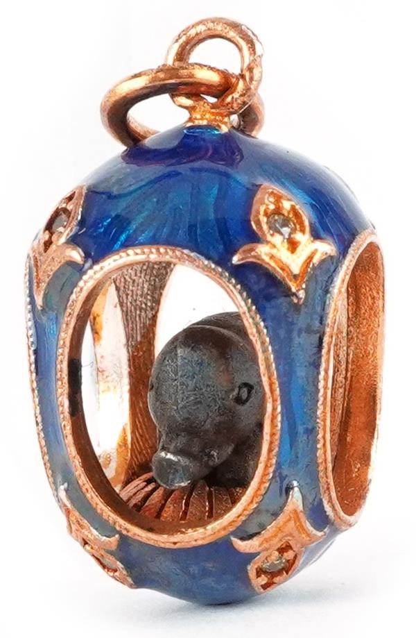 14ct gold and guilloche enamel pendant in the form of an elephant in an egg, set with clear